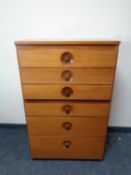 A Meredew teak six drawer chest