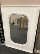 A 3' x 2' white framed mirror
