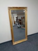 A Victorian style gilt bevelled over mantel mirror