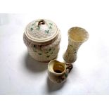 Three pieces of Belleek cloverleaf patterned china to include lidded biscuit barrel,