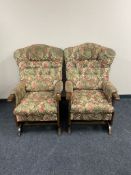 A pair of 20th century beech framed floral upholstered rocking chairs