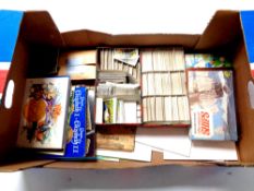A box containing a quantity of cigarette and tea card albums and cards