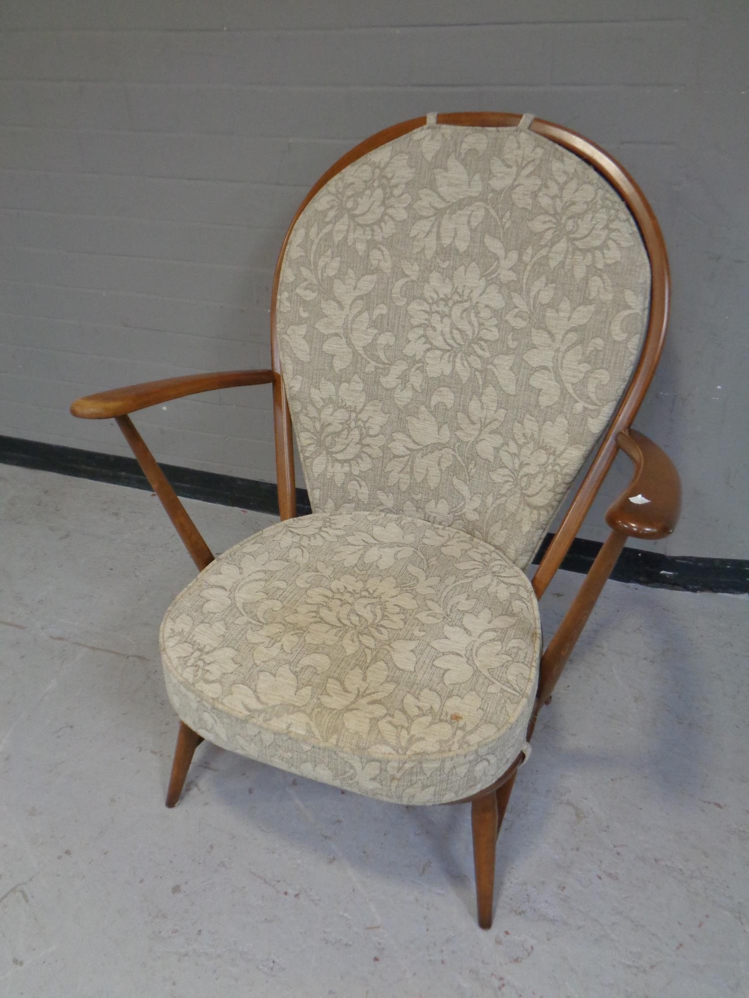 An Ercol solid elm and beech armchair