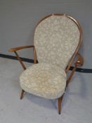 An Ercol solid elm and beech armchair