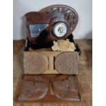 A box containing antique and later wooden pieces to include book slides, wooden trivet,