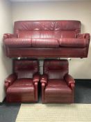 A Burgundy leather three piece lounge suite