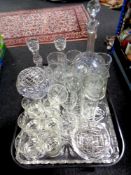 A tray of assorted glass ware : decanter, candlesticks, etched drinking glasses,