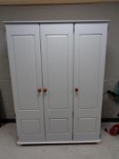 A painted pine triple door wardrobe