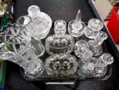 A tray of assorted glass wares to include jelly moulds, sugar sifter, candlesticks,