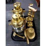 A box containing antique and later brass ware to include candlesticks, shoehorn, letter opener,