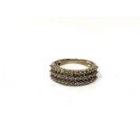 A 9ct white gold five row diamond half eternity ring