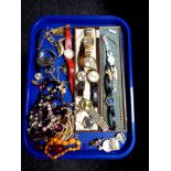 A tray of a collection of costume jewellery to include beaded necklaces, brooches, simulated pearls,