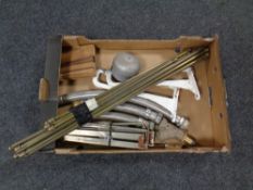 A box containing miscellany to include brass stair rods, pair of cast iron wall brackets,