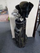 A Howson golf bag containing Howson drivers and Regal Axxis irons