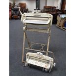 A vintage Acme mangle on stand together with a further mangle
