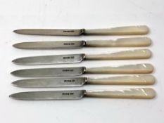 Six silver bladed table knifes with mother of pearl handles