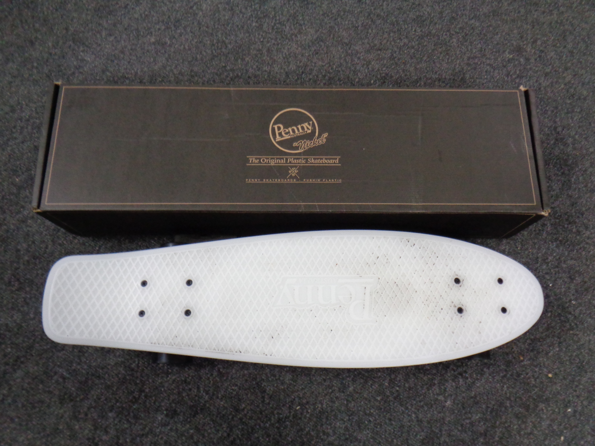 A boxed Penny Australia nickel plastic skate board