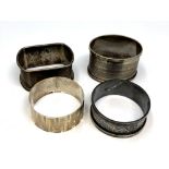 Four assorted silver napkin rings CONDITION REPORT: 85.