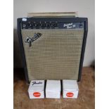 A Fender Sidekick bass 30 guitar amplifier together with three Fender and Epiphone amp foot