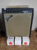 A Fender Sidekick bass 30 guitar amplifier together with three Fender and Epiphone amp foot
