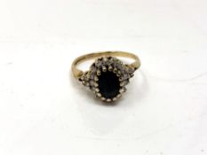 A 9ct gold diamond and sapphire cluster ring,