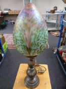 An Art Deco style table lamp with an iridescent glass shade