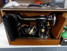 A cased 20th century Singer electric sewing machine