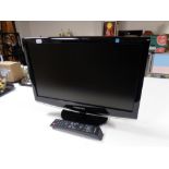 A Samsung Sync Master 19'' LCD TV with remote,