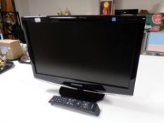 A Samsung Sync Master 19'' LCD TV with remote,