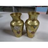 A pair of oriental style brass embossed vases, height 12.