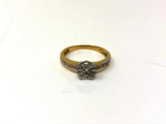 A pie-cut diamond ring on yellow gold shank set with diamond shoulders, size L.
