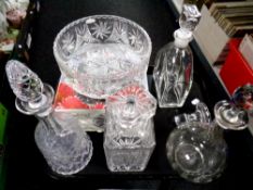 A boxed Pin Wheel lead crystal bowl together with four assorted decanters with five stoppers