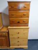 A pine effect four drawer chest together with a pine three drawer chest