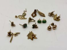 Ten various pairs of 9ct gold earrings, together with two further singles.