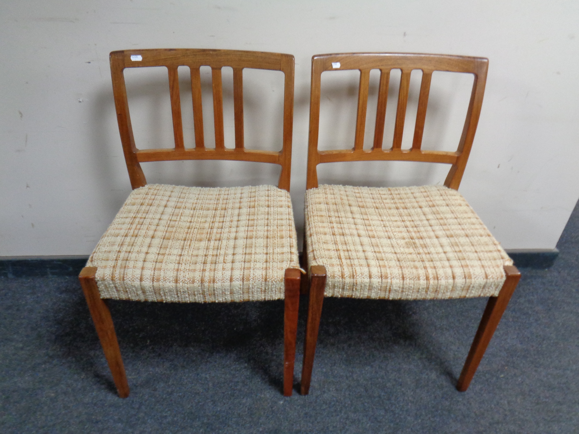 A pair of mid 20th century Danish teak chairs