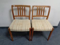 A pair of mid 20th century Danish teak chairs
