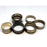 Six assorted silver napkin rings CONDITION REPORT: 77.