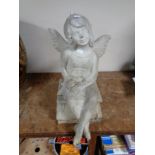 A plastic garden figure of a fairy