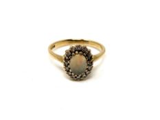A 9ct gold opal and diamond ring,