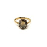 A 9ct gold opal and diamond ring,
