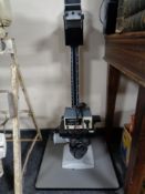 An inverted microscope with power supply unit together with a CS920 copier/enlarger stand