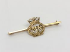 A gold and enamel Merchant Navy brooch