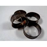A set of four antique silver napkin rings
