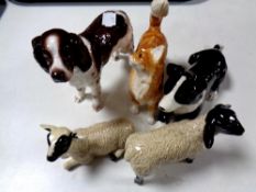 Four John Beswick figures to include sheep dog and two lambs,