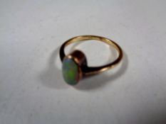 A gold opal ring (hallmarks rubbed)