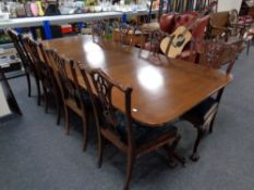 A twin pedestal mahogany dining table with two extension leaves, total length 304 cm,