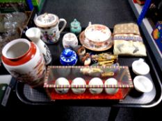 A tray of oriental wares to include hand painted eggs and display case, antique teacup and saucer,