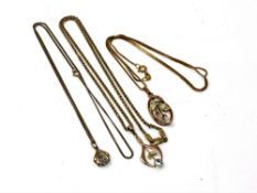 Three 9ct gold pendants on chains,