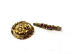 A 9ct gold ruby bar brooch together with a further 9ct gold brooch set with a pearl (2)