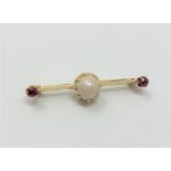 A yellow gold ruby and cultured pearl bar brooch CONDITION REPORT: Apparently